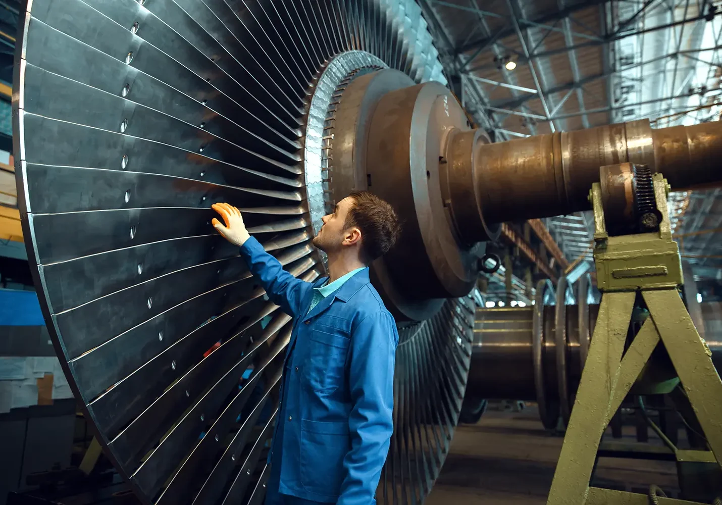 engineer-checks-turbine-impeller-vanes-factory